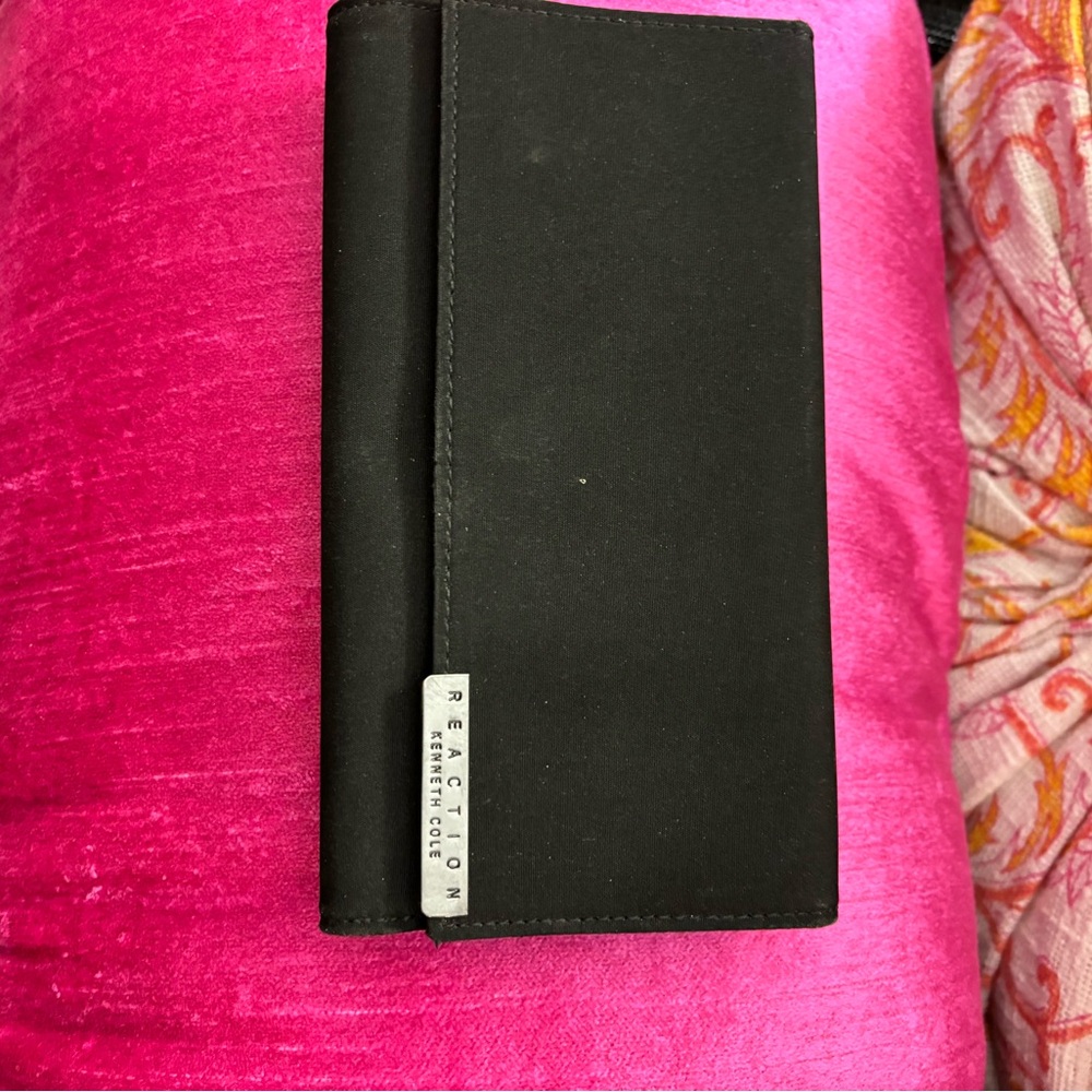 Reaction black silkish wallet.
